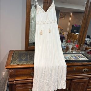 Maxi dress cream color with pretty embroidery lined. Size large